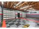 Finished garage with Corvette themed flooring and shelving at 1528 Walker Rd, Lakeland, FL 33810