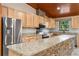 Kitchen with granite countertops, stainless steel appliances, and stone accents at 1528 Walker Rd, Lakeland, FL 33810