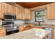 Kitchen boasts granite countertops and stainless steel appliances at 1528 Walker Rd, Lakeland, FL 33810