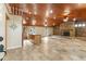 Open living area with high ceilings, stone fireplace, and tile floors at 1528 Walker Rd, Lakeland, FL 33810