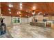 Open floor plan showing kitchen, living room, and stone fireplace at 1528 Walker Rd, Lakeland, FL 33810