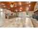 Open floor plan showcasing kitchen, living area, and stone fireplace at 1528 Walker Rd, Lakeland, FL 33810