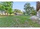 Large grassy yard with detached garage visible at 1528 Walker Rd, Lakeland, FL 33810