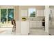 Open concept kitchen with island, white cabinetry, and stainless steel appliances at 2653 Skyline Loop, Kissimmee, FL 34758
