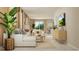 Open concept living room with sectional sofa, coffee table, and view into kitchen at 2653 Skyline Loop, Kissimmee, FL 34758