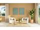 Living room with two armchairs, a coffee table, and a large plant at 2653 Skyline Loop, Kissimmee, FL 34758