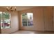 Bright dining room with a chandelier and large windows at 2938 Egrets Landing Dr, Lake Mary, FL 32746