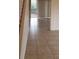 Tile hallway with view into living area and backyard at 2938 Egrets Landing Dr, Lake Mary, FL 32746