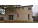 Two-story house back view, showing sliding glass doors and a yard at 2938 Egrets Landing Dr, Lake Mary, FL 32746