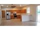 Kitchen with stainless steel appliances and light wood cabinets at 2938 Egrets Landing Dr, Lake Mary, FL 32746