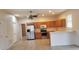 Kitchen boasts stainless steel appliances and light wood cabinets at 2938 Egrets Landing Dr, Lake Mary, FL 32746