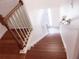Clean wooden staircase with white railings leading to the upper level at 2938 Egrets Landing Dr, Lake Mary, FL 32746