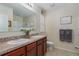 Double vanity bathroom with granite countertop and tiled floor at 3219 Bayou Bay Dr, Lakeland, FL 33811