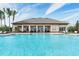 Community pool with clubhouse in background at 3219 Bayou Bay Dr, Lakeland, FL 33811