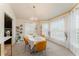 Dining room with oval table, yellow chairs, and window seating at 644 Hudson Valley Dr, Kissimmee, FL 34759