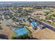 Aerial view of community with clubhouse, pool, and tennis courts at 14544 Sw 112Th Cir, Dunnellon, FL 34432