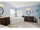 Spa-like bathroom with corner soaking tub and double vanity at 14544 Sw 112Th Cir, Dunnellon, FL 34432