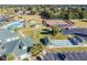 Aerial view of community tennis courts, shuffleboard, and pool at 14544 Sw 112Th Cir, Dunnellon, FL 34432