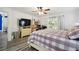 Main bedroom with king-size bed, built-in shelving, and private access at 14544 Sw 112Th Cir, Dunnellon, FL 34432