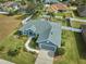 Single-story home with gray exterior, landscaping, and driveway at 4545 Mandolin Blvd, Winter Haven, FL 33884