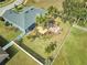 An aerial view showcases a home's backyard oasis with a deck and pergola at 4545 Mandolin Blvd, Winter Haven, FL 33884