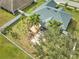 Aerial view of a home with a large backyard, deck, and pergola at 4545 Mandolin Blvd, Winter Haven, FL 33884