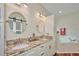 Elegant bathroom with granite double vanity and large soaking tub at 4545 Mandolin Blvd, Winter Haven, FL 33884