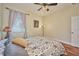 Charming bedroom with hardwood floors and plenty of natural light at 4545 Mandolin Blvd, Winter Haven, FL 33884