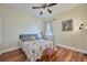 Bedroom with wood flooring, a queen bed, and built in closet at 4545 Mandolin Blvd, Winter Haven, FL 33884