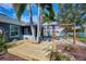 Expansive deck with pergola, palm trees, and backyard access at 4545 Mandolin Blvd, Winter Haven, FL 33884