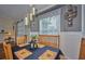 Bright dining room featuring a wood table, chairs, and decorative placemats at 4545 Mandolin Blvd, Winter Haven, FL 33884