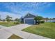 Single-story home with a gray exterior and a two-car garage at 4545 Mandolin Blvd, Winter Haven, FL 33884