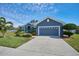 Single-story home with a gray exterior and a two-car garage at 4545 Mandolin Blvd, Winter Haven, FL 33884