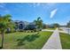 Inviting front yard with lush landscaping and a welcoming walkway at 4545 Mandolin Blvd, Winter Haven, FL 33884