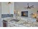 Kitchen sink and granite countertop with a view to the living area at 4545 Mandolin Blvd, Winter Haven, FL 33884