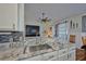 Kitchen with granite countertop, sink, and a view into the living room at 4545 Mandolin Blvd, Winter Haven, FL 33884