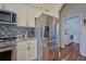 Stainless steel refrigerator and kitchen area with granite counters at 4545 Mandolin Blvd, Winter Haven, FL 33884