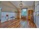 Bright living room with hardwood floors and built-in shelving at 4545 Mandolin Blvd, Winter Haven, FL 33884