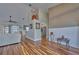 Open living space with hardwood floors, a view into the kitchen, and a high ceiling at 4545 Mandolin Blvd, Winter Haven, FL 33884