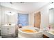 Bathroom with a garden tub and double vanity at 4844 Creek Meadow Trl, Lakeland, FL 33810