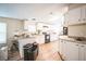 Efficient kitchen with white cabinets and granite countertops at 4844 Creek Meadow Trl, Lakeland, FL 33810