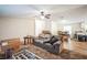 Spacious living room with a sofa and view into the kitchen at 4844 Creek Meadow Trl, Lakeland, FL 33810