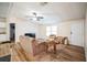 Living room with sofa, coffee table and wood-look flooring at 4844 Creek Meadow Trl, Lakeland, FL 33810