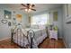 Charming bedroom with unique iron bed frame and terracotta tile floors at 6104 Irby W Ln, Lakeland, FL 33811