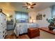 Large bedroom with ceiling fan and plenty of natural light at 6104 Irby W Ln, Lakeland, FL 33811