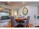 Charming dining area with a round wooden table and gray chairs at 6104 Irby W Ln, Lakeland, FL 33811