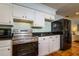 Stainless steel appliances and white cabinets in this kitchen at 6104 Irby W Ln, Lakeland, FL 33811