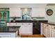 Modern kitchen with white cabinets and black granite countertops at 6104 Irby W Ln, Lakeland, FL 33811