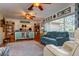 Bright and airy living room with large windows and wood shelving at 6104 Irby W Ln, Lakeland, FL 33811