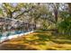 Screened-in pool with surrounding yard at 6104 Irby W Ln, Lakeland, FL 33811